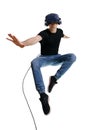 Young male flying on white backgroung like superhero while looking in VR goggles Royalty Free Stock Photo