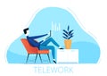 A young male freelancer sits in a chair and works remotely from home. The concept of telework during quarantine and isolation due