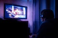 Young male gamer playing video game at home Royalty Free Stock Photo