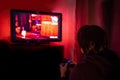 Young male gamer playing video game at home Royalty Free Stock Photo