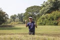 Young male golf player grey pants chipping golf ball out of a sa Royalty Free Stock Photo