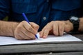 Young male hands filling out forms. Young man writing Royalty Free Stock Photo