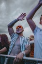 Young male happily singing during electronic music festival Electrifinity in Bad Aibling,Germany