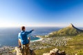 Young male hiker sitting on a rock at Kasteelspoort Hiking Trail in Table Mountain National Park in Cape Town