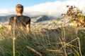 Young male hiker sitting on the summit of Diamond Head Crater in Honolulu on the Island of Oahu, Hawaii Royalty Free Stock Photo