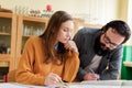 Young male hispanic teacher helping his student in chemistry class. Education, Tutoring concept. Royalty Free Stock Photo