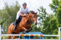 Young male horse rider on show jumping competition Royalty Free Stock Photo