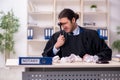 Young male judge working in courthouse