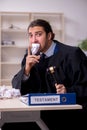 Young male judge working in courthouse