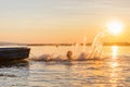 Young male jumping into the Danube river during scenic sunset in Serbia Royalty Free Stock Photo