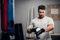 A young male kickboxer begins to warm up before sparring with a gym. Royalty Free Stock Photo