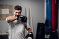 a young male kickboxer begins to warm up before sparring with a gym. Royalty Free Stock Photo