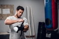 a young male kickboxer begins to warm up before sparring with a gym. Royalty Free Stock Photo