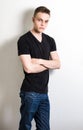 Young male leaning on wall portrait