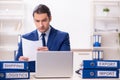 Young male logistics specialist working in the office Royalty Free Stock Photo