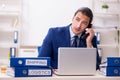 Young male logistics specialist working in the office Royalty Free Stock Photo