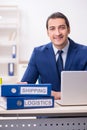 Young male logistics specialist working in the office Royalty Free Stock Photo
