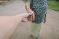 Young male man holding his grandmother hand with carefulness Royalty Free Stock Photo