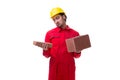 Young male mason with brick isolated on white Royalty Free Stock Photo