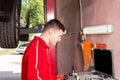 Young male mechanic checking the readout Royalty Free Stock Photo