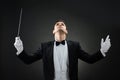 Music Conductor Looking Up While Holding Baton Royalty Free Stock Photo