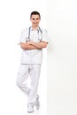 Young male nurse lean on the wall Royalty Free Stock Photo