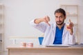 Young male odontologist working in the clinic