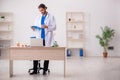 Young male odontologist working in the clinic