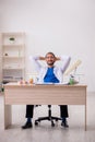 Young male odontologist working in the clinic