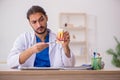 Young male odontologist working in the clinic