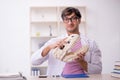 Young male paleontologist examining ancient animals at lab Royalty Free Stock Photo