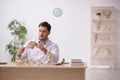 Young male paleontologist examining ancient animals at lab Royalty Free Stock Photo