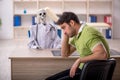 Young male patient visiting skeleton doctor Royalty Free Stock Photo