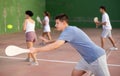 Young male pelota player hitting ball with racket Royalty Free Stock Photo