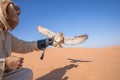 Young male pharaoh eagle owl during a desert falconry show in Dubai, UAE. Royalty Free Stock Photo
