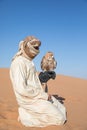 Young male pharaoh eagle owl during a desert falconry show in Dubai, UAE. Royalty Free Stock Photo