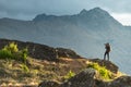 Young male photographer taking photo of scenery in Queenstown Royalty Free Stock Photo