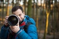 Young, male photographer taking photos Royalty Free Stock Photo