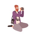 Young male photographer with TLR, digital and 35 mm cameras. Portrait of creative photojournalist with modern and retro