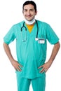 Young male physician posing confidently