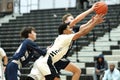 Young male players on the court at a fall Merrillville high school basketball game Royalty Free Stock Photo