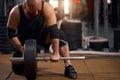 Powerlifter changing iron discs in gym Royalty Free Stock Photo