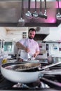 Chef preparing beef fillet steak in a frying pan