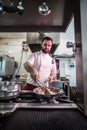 Chef preparing beef fillet steak in a frying pan