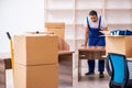 Young male professional mover doing home relocation