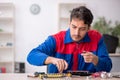 Young male repairman repairing computer Royalty Free Stock Photo