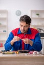 Young male repairman repairing computer Royalty Free Stock Photo