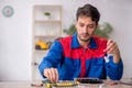 Young male repairman repairing computer Royalty Free Stock Photo