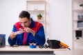 Young male repairman repairing computer Royalty Free Stock Photo
