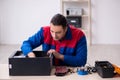 Young male repairman repairing computer Royalty Free Stock Photo